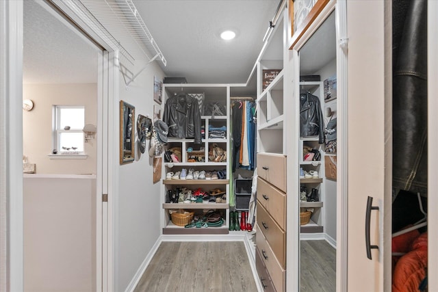 1911 Ladybird Ln, Gulf Breeze, FL 32563 - spacious closet featuring wood finished floors