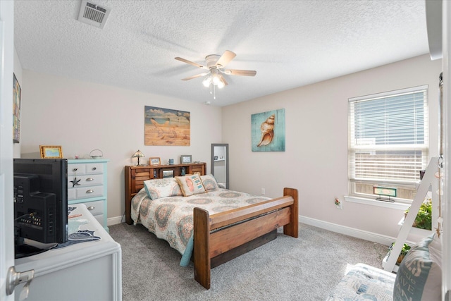 1911 Ladybird Ln, Gulf Breeze, FL 32563 - bedroom featuring light carpet, baseboards, visible vents, and a textured ceiling