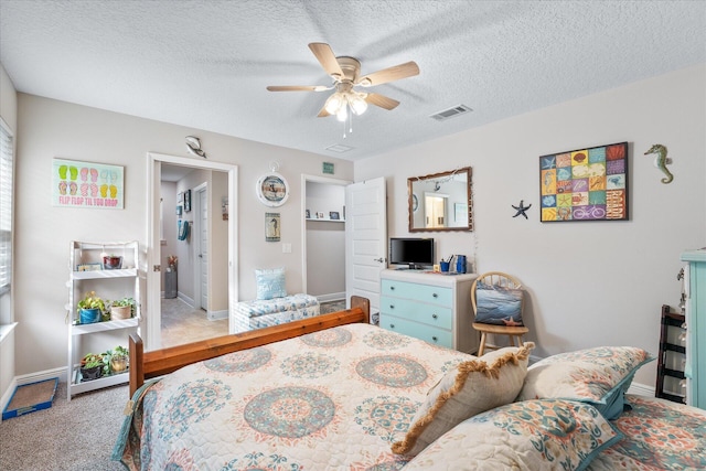 1911 Ladybird Ln, Gulf Breeze, FL 32563 - bedroom with baseboards, a textured ceiling, visible vents, and light colored carpet