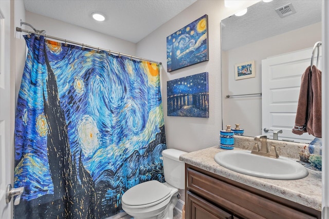 1911 Ladybird Ln, Gulf Breeze, FL 32563 - full bath with a textured ceiling, visible vents, a shower with shower curtain, toilet, and vanity