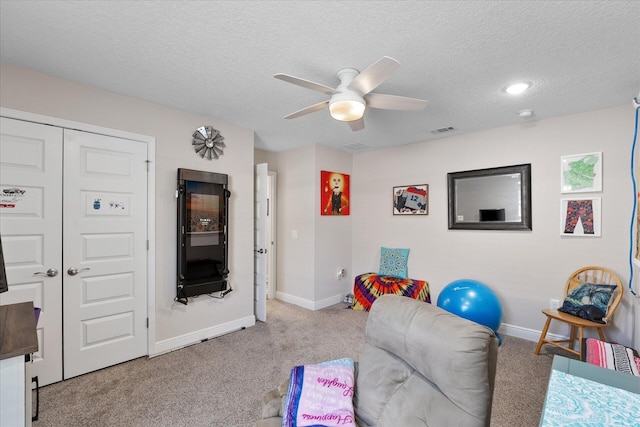 1911 Ladybird Ln, Gulf Breeze, FL 32563 - rec room featuring carpet flooring, a textured ceiling, baseboards, visible vents, and ceiling fan