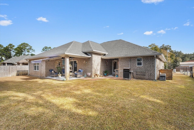 1911 Ladybird Ln, Gulf Breeze, FL 32563 - back of property with brick siding, a yard, and a patio area