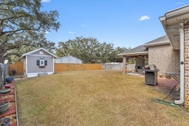 1911 Ladybird Ln, Gulf Breeze, FL 32563 - view of yard with a fenced backyard, an outbuilding, and a patio