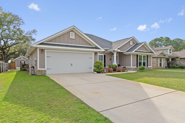 1911 Ladybird Ln, Gulf Breeze, FL 32563 - craftsman-style house with driveway, a front yard, an attached garage, and board and batten siding