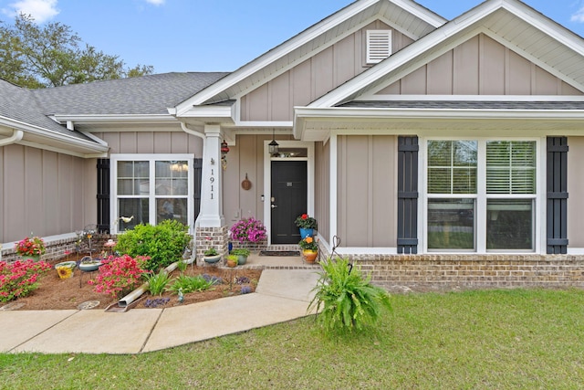 1911 Ladybird Ln, Gulf Breeze, FL 32563 - view of front of house featuring a shingled roof and board and batten siding