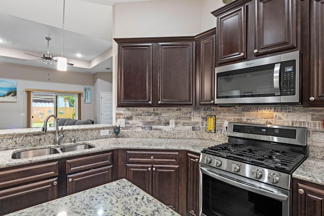 1911 Ladybird Ln, Gulf Breeze, FL 32563 - kitchen featuring a sink, dark brown cabinetry, and appliances with stainless steel finishes