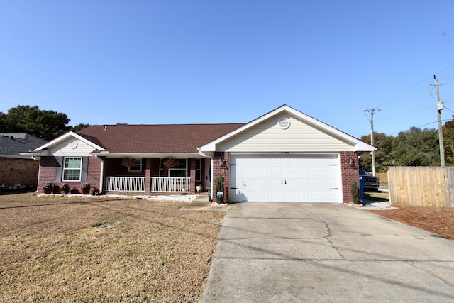 single story home featuring a porch, a garage, and a front lawn