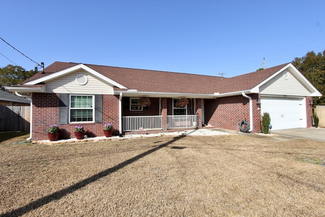 ranch-style house featuring a garage, a front lawn, and a porch