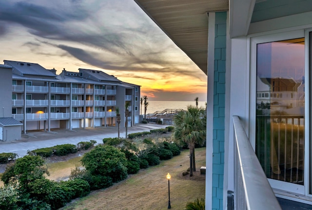 balcony at dusk with a water view