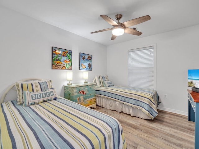 bedroom featuring hardwood / wood-style floors and ceiling fan