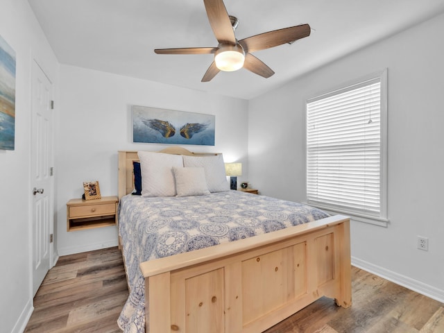 bedroom featuring ceiling fan and light wood-type flooring