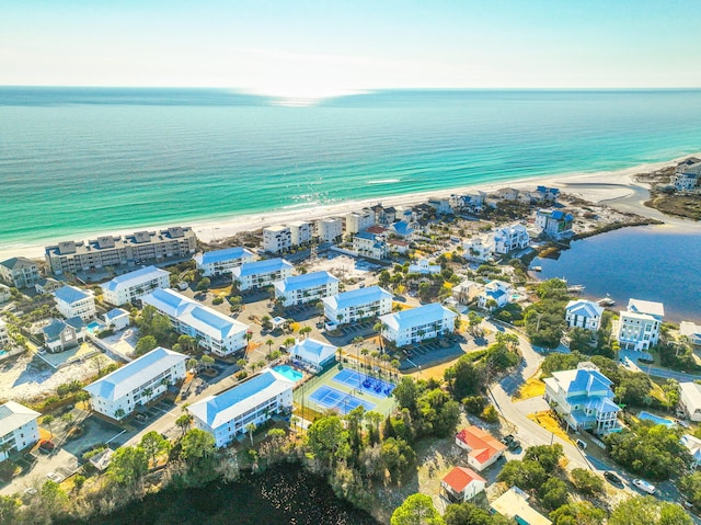 bird's eye view with a water view and a beach view