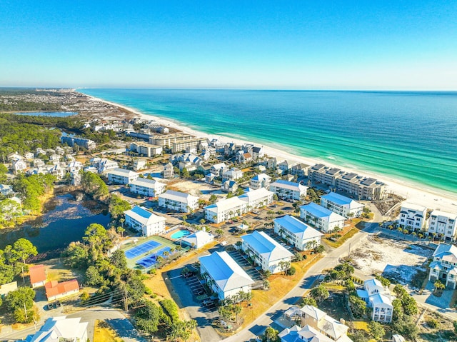 birds eye view of property featuring a view of the beach and a water view