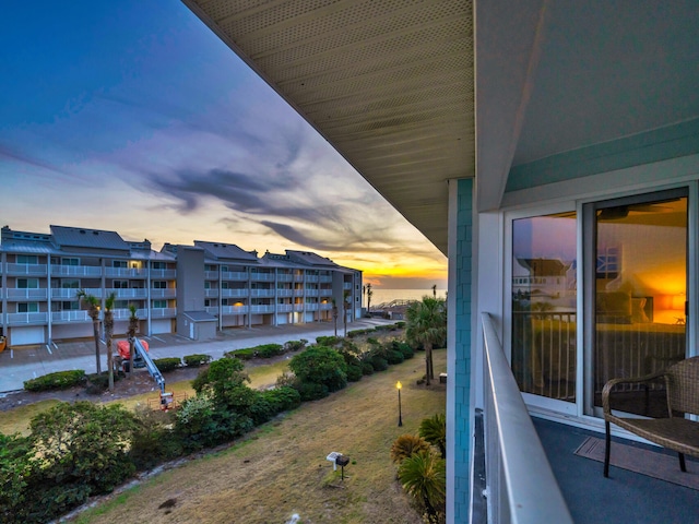 view of balcony at dusk