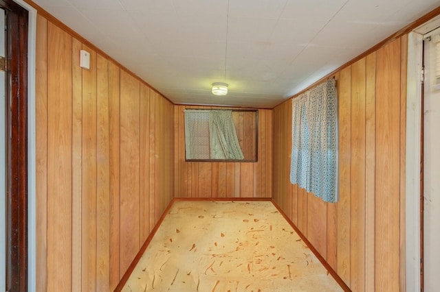 empty room featuring wooden walls