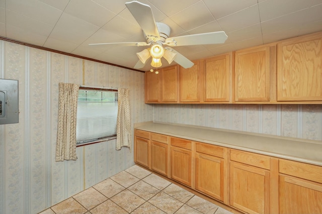 kitchen featuring ceiling fan, electric panel, light brown cabinets, and light tile patterned floors