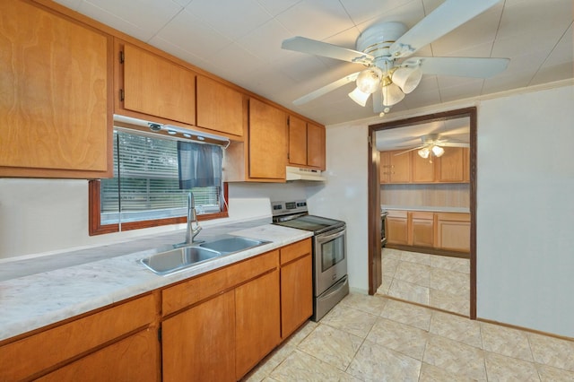 kitchen featuring sink, stainless steel range with electric cooktop, and ceiling fan