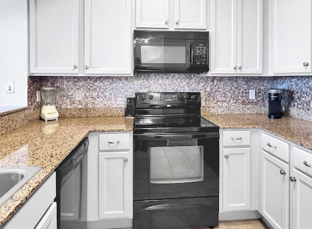 kitchen featuring white cabinetry, decorative backsplash, and black appliances