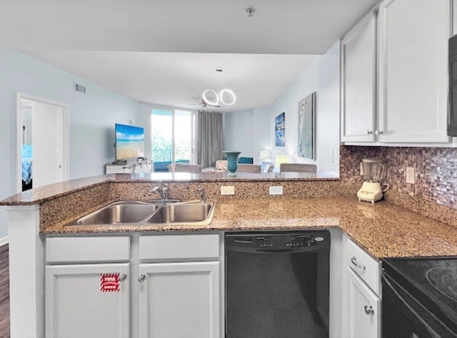 kitchen featuring sink, kitchen peninsula, white cabinets, and black dishwasher