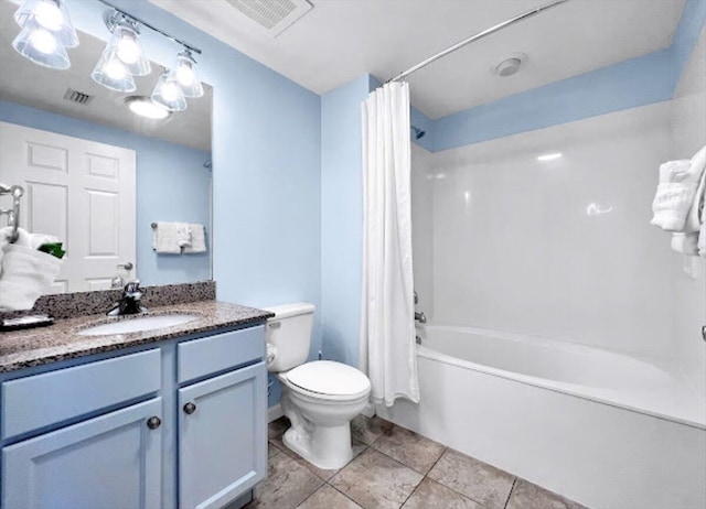 full bathroom with shower / tub combo with curtain, vanity, tile patterned flooring, and toilet