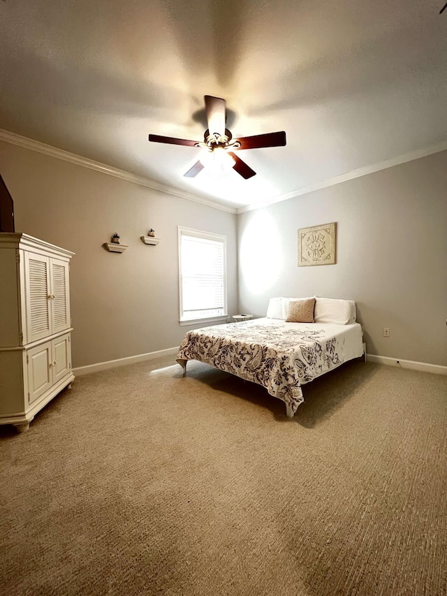 carpeted bedroom with ceiling fan and ornamental molding