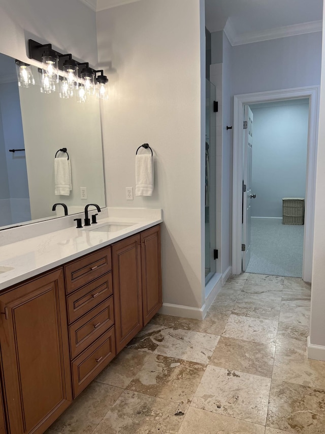 bathroom featuring a shower with door, ornamental molding, and vanity