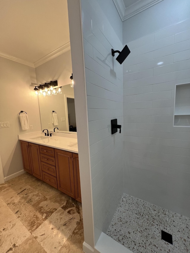 bathroom featuring crown molding, vanity, and a tile shower