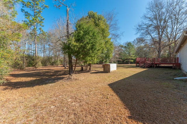 view of yard with a wooden deck