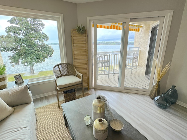 interior space featuring a water view and hardwood / wood-style flooring