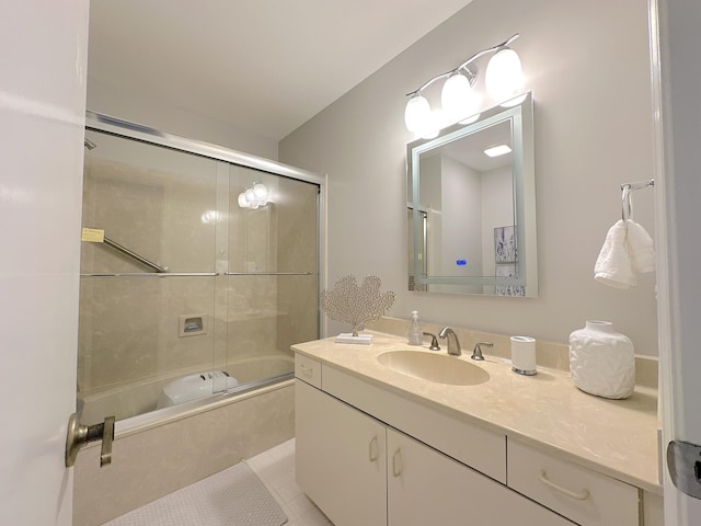 bathroom with vanity, bath / shower combo with glass door, and tile patterned floors