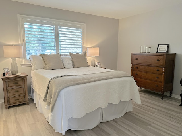 bedroom with light hardwood / wood-style floors