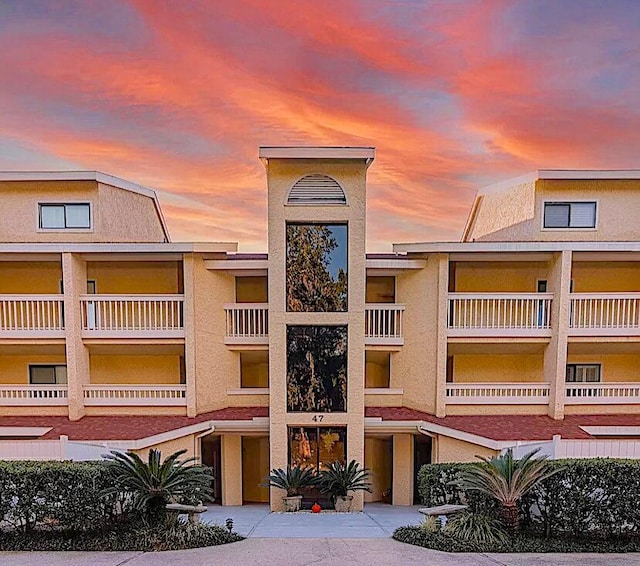 view of outdoor building at dusk