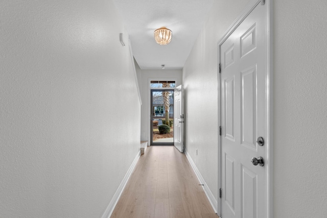 hallway with light wood-type flooring