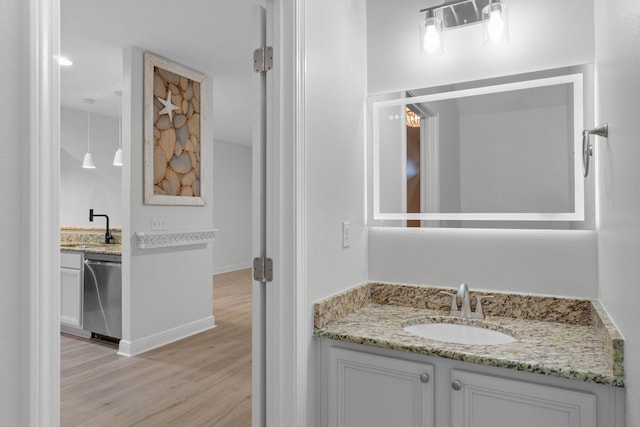 bathroom featuring vanity and hardwood / wood-style flooring