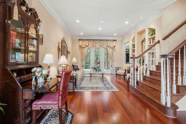 interior space featuring wood-type flooring and ornamental molding