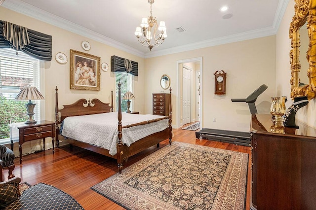 bedroom with multiple windows, wood-type flooring, and ornamental molding