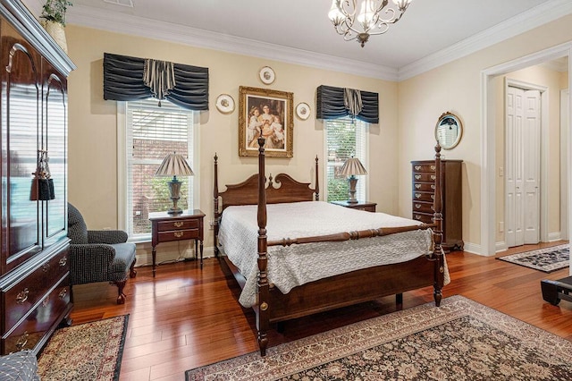 bedroom featuring a chandelier, crown molding, and dark hardwood / wood-style floors