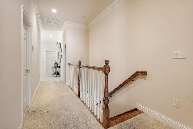 hallway with light carpet and ornamental molding