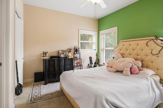 carpeted bedroom with ceiling fan