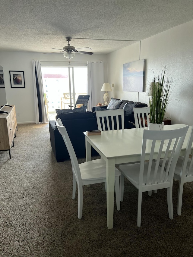 dining space with light colored carpet, a textured ceiling, and ceiling fan