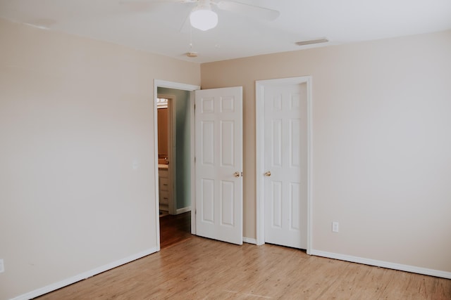 unfurnished bedroom with ceiling fan and light hardwood / wood-style floors