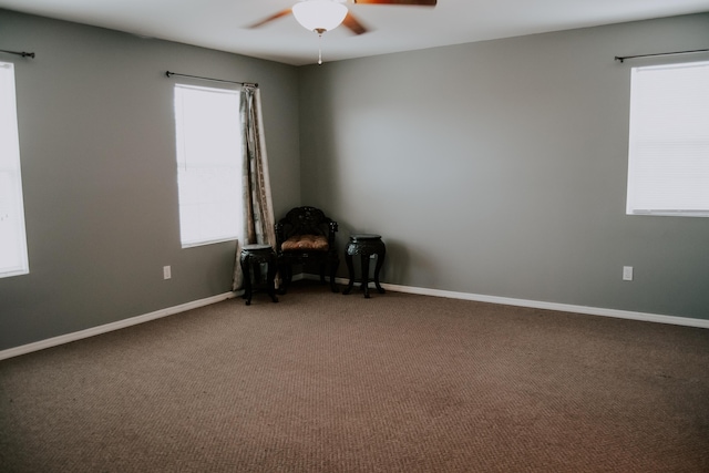 empty room with carpet floors and ceiling fan