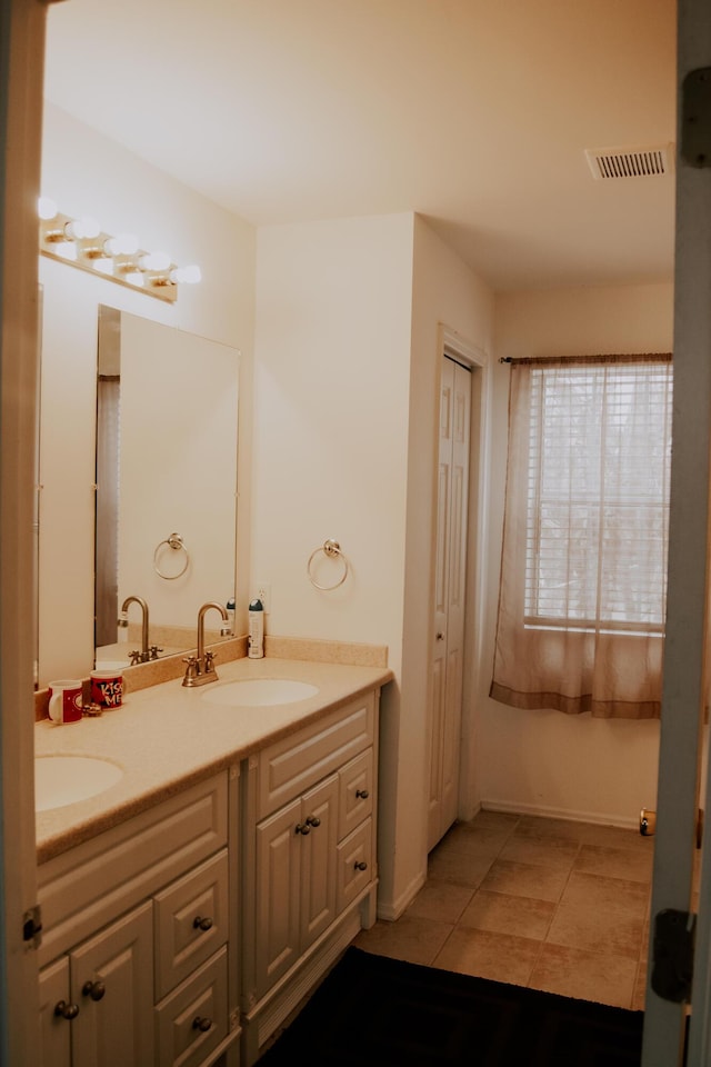 bathroom with vanity and tile patterned floors