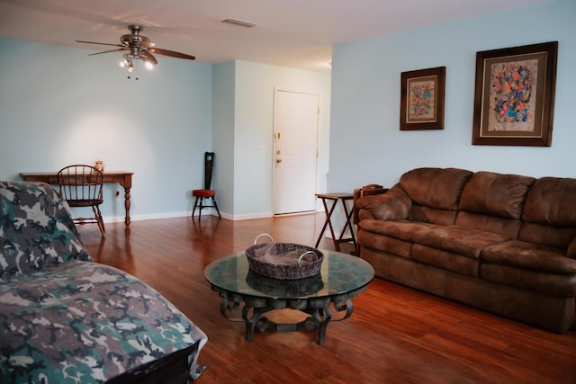 living room with ceiling fan and dark hardwood / wood-style floors