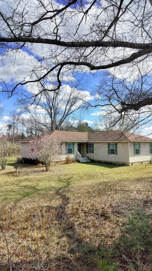 ranch-style house with a front yard