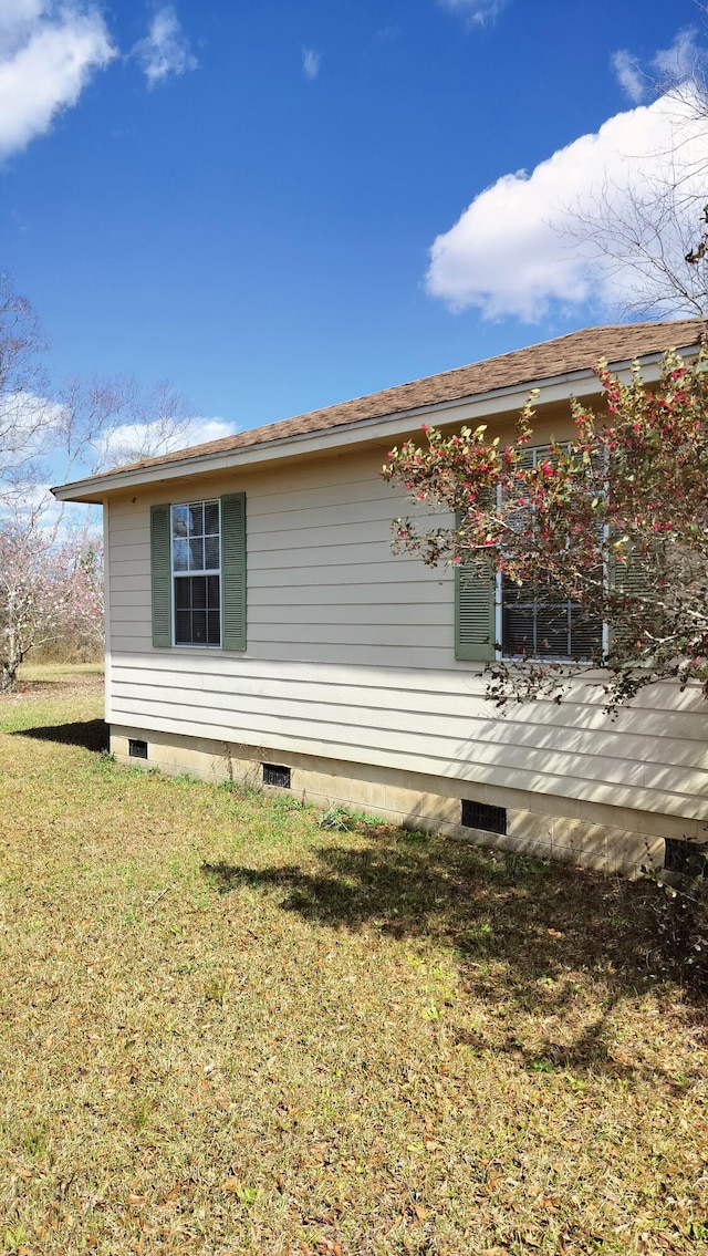 view of property exterior with a yard