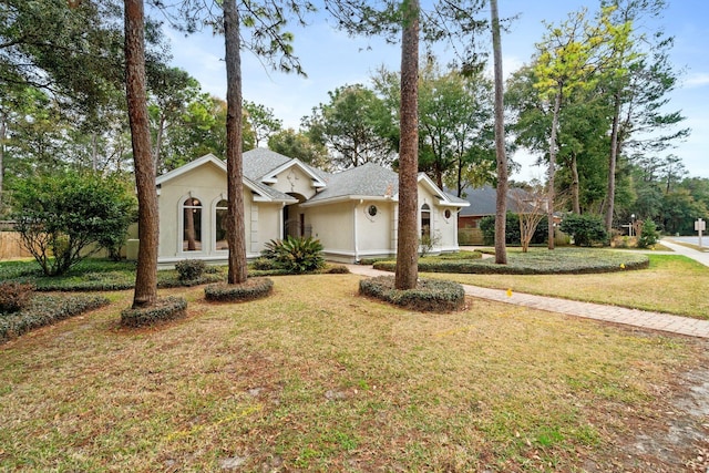 single story home with a front yard