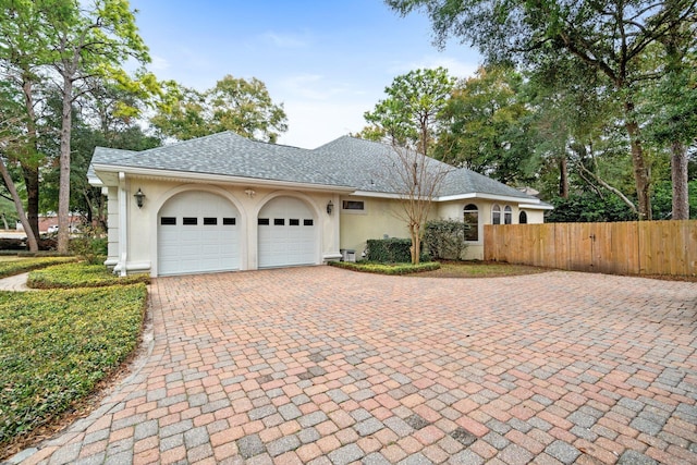 ranch-style house featuring a garage