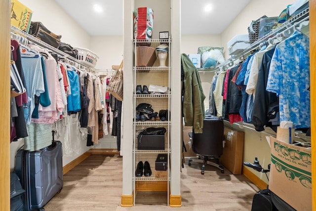 walk in closet featuring light hardwood / wood-style floors