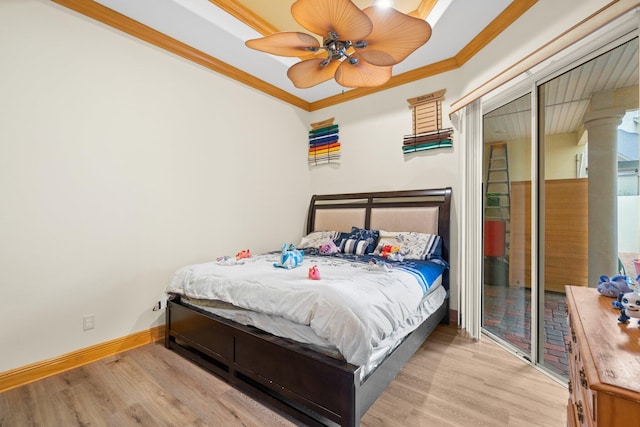 bedroom featuring crown molding, light hardwood / wood-style floors, and ceiling fan